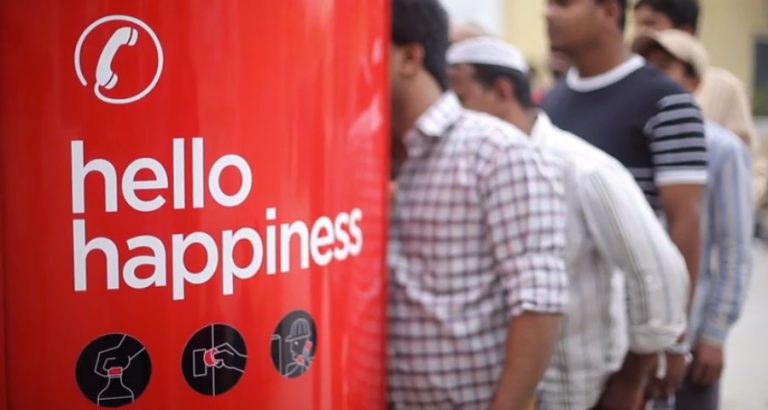 Coca-Cola launches Hello Happiness campaign, sets Coca-Cola phone booth with bottle caps as currency