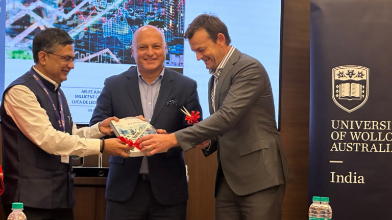 L to R-NSE CEO Ashishkumar Chauhan, University of Wollongong's Deputy VC Alex Frino and UOW Global Ambassador Adam Gilchrist unveil book on Introduction to Corporate Finance at NSE
