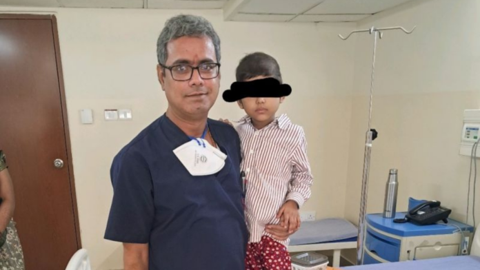 Dr Ashok Kumar with patient