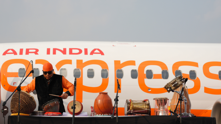 Air India Express dazzles at Wings India 2024 with a live concert by Sivamani on the tarmac, showcasing the new 'Kalamkari' aircraft.